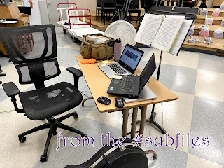 chair and desk with two computers