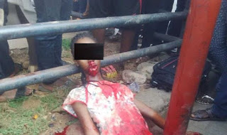 a sister in laying on road side stained with blood