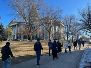 Image of Blind Coloradans walking past the CO state capitol