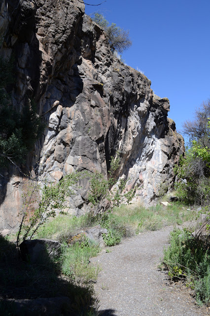 approaching the painting, taking in the rock face