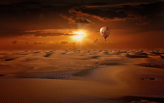 hot air balloon desert sunrise