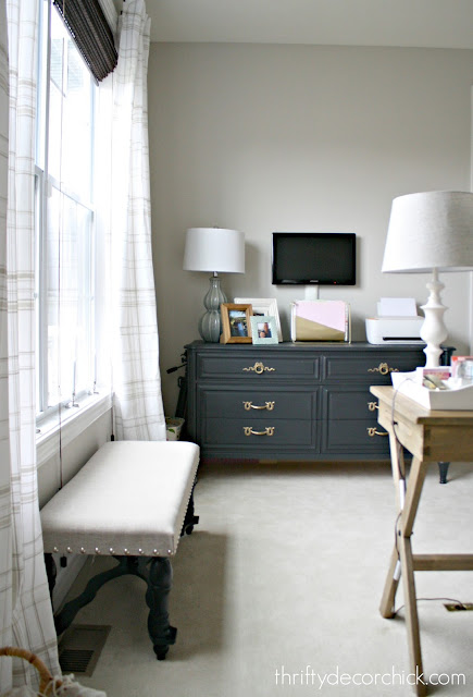 Black dresser with brass hardware