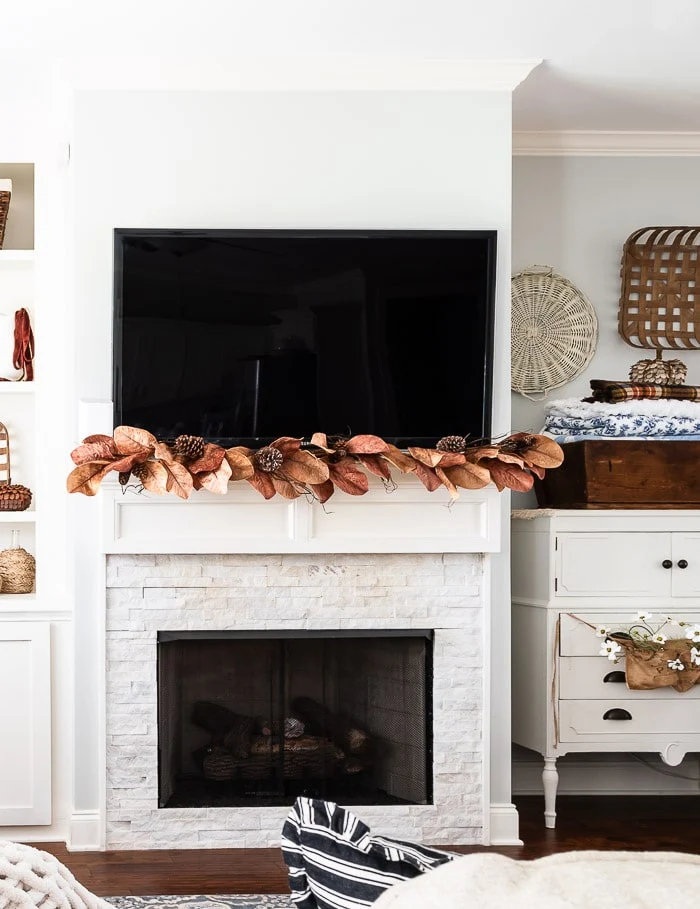 fireplace mantel, brown fall leaves garland