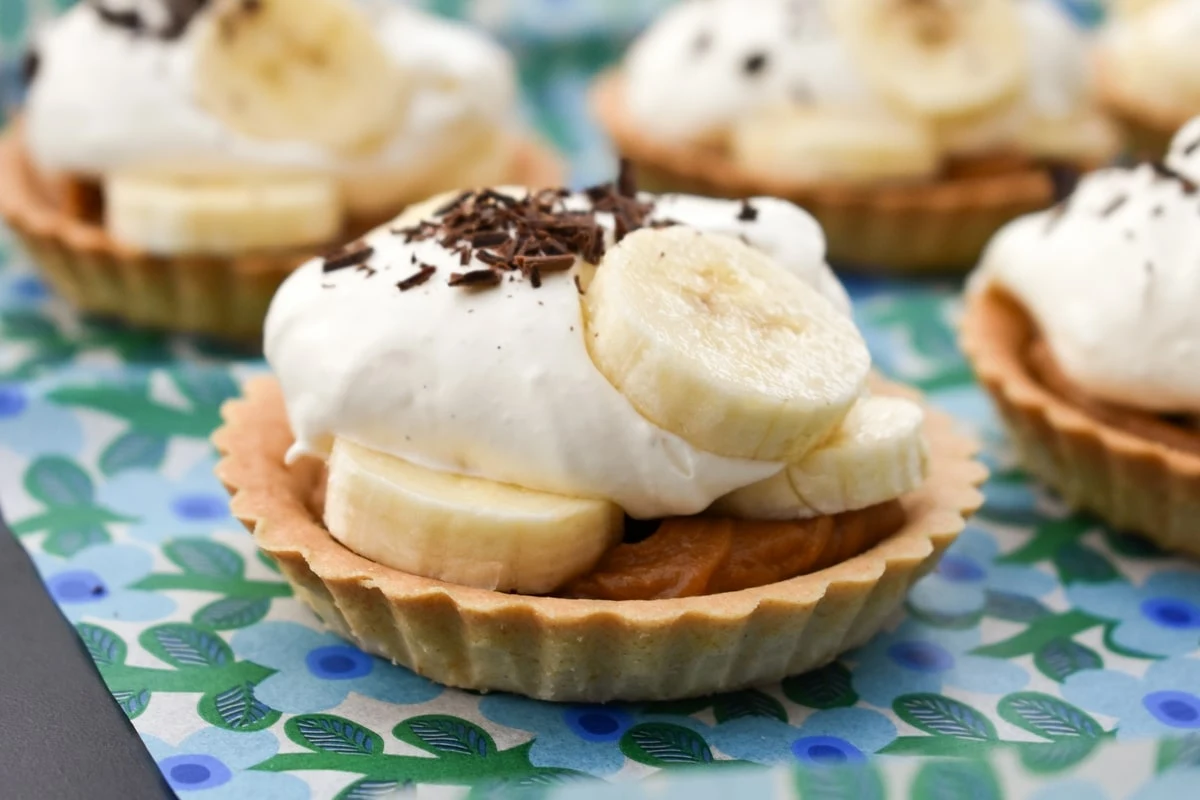 small banoffee pies in shortcrust pastry cases.