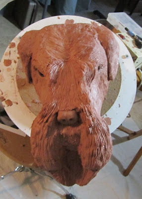 dog head clay sculpture