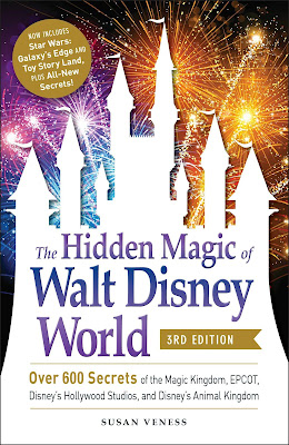 Book cover for the Hidden Magic of Walt Disney World showing a castle with fireworks in the background.