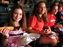 Kathleen Bigley, Jaclyn Bigley and Megan Irving enjoying their hot dogs