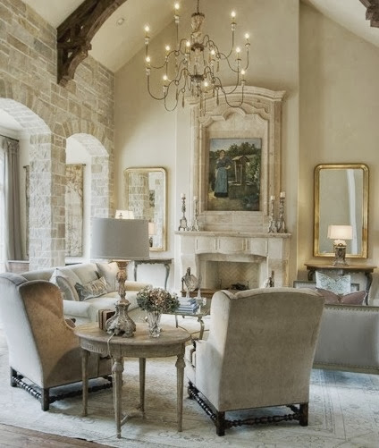 large white living room with gold accents beige neutral furniture stone walls