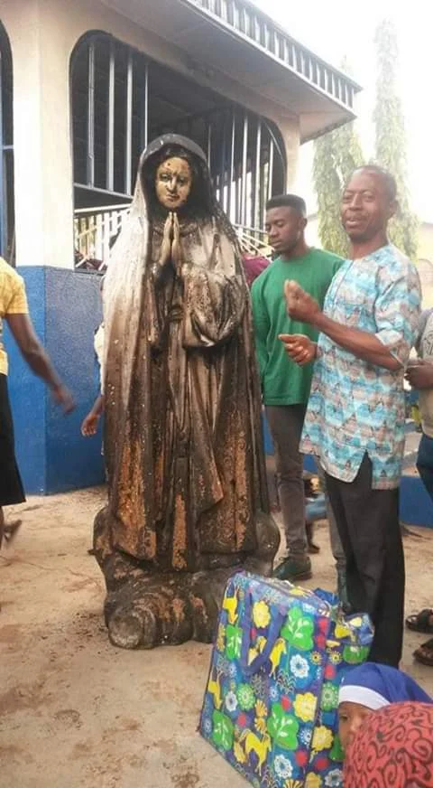 Photos: Woman sets statue of Virgin Mary ablaze at a Catholic Church in Enugu