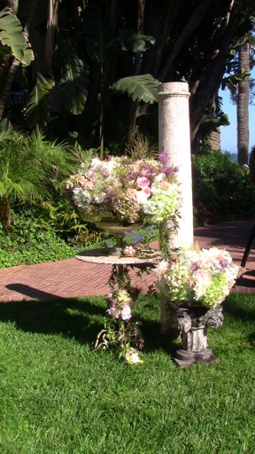 I used vintage columns lovely old iron tables and silver urns filled to 