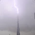 Striking lightning: Bolt hits the world's tallest building in a spectacular display in the skies above Dubai