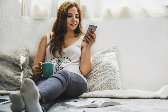 Woman reading on her phone