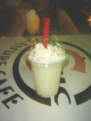 My kiwi ice blended drink. The whipped cream is laced with coconut - yucks! :P