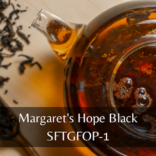 Photo of glass teapot full of black tea with text overlay reading "Margaret's Hope Black SFTGFOP-1"