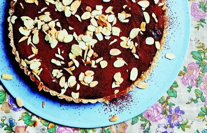 Chocolate Caramel Tart on a blue plate