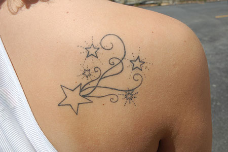 stars tattoos on side. side like an owl an#39; said,