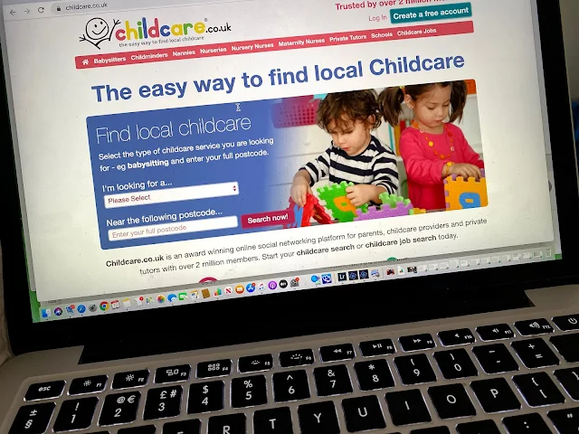 photo of a MacBook open on the childcare.co.uk website home page