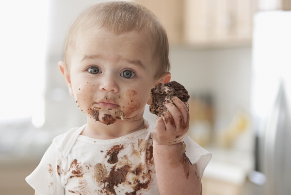 Cute Baby Boy with Chocolate