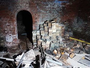 <img src="img_ tunnel entrance to manchester gasworks.jpg" alt="Image of stone work stacked close to the entrance">