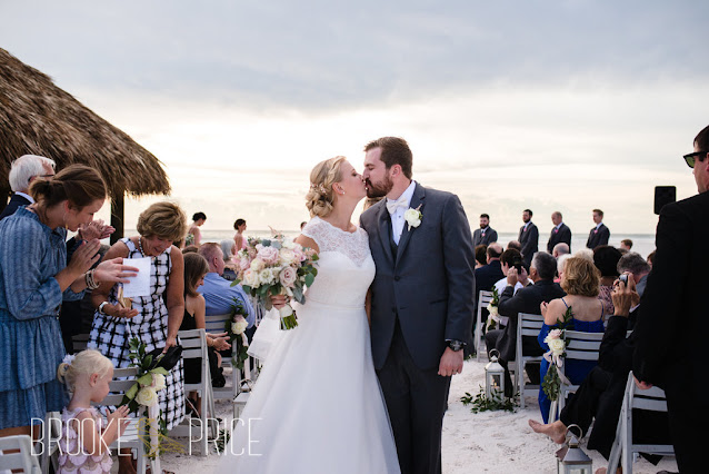 bride and groom kiss just married