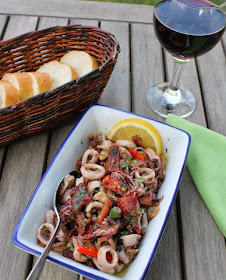 Food Lust People Love: A wonderfully fragrant tapas dish with smoked bacon pan-fried to crispy nuggets of deliciousness, along with the chilies, garlic and squid. You'll love this Squid with Garlic Chili Olive Oil.