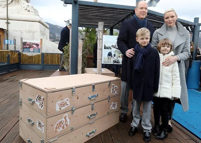 Princess Charlene wore a Fada cashmere double-face melange trench coat by Akris. Princess Gabriella in Herno Kids