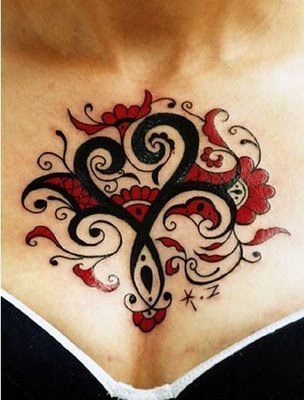 Artsy chest tattoo for women.