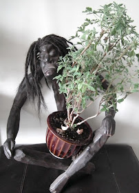 Asmat handcarved statue_with Rober's Lemon Rose