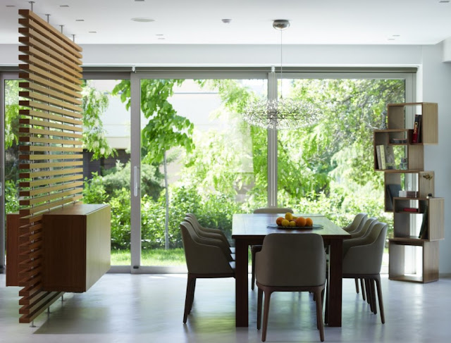 Dining room with vegetation outside 