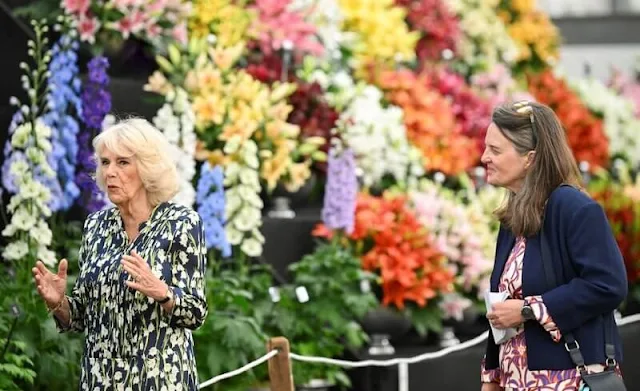 Queen Camilla wore a floral print silk shirt dress by Suzannah. Royal Horticultural Society Great Spring Show