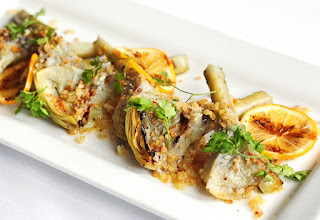 http://paragarys.com/the-epicurator/recipes/grilled-artichokes-with-garlic-anchovy-lemon-and-breadcrumbs/