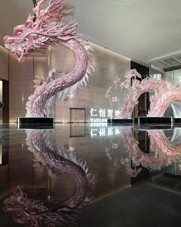 enormous pink and white 3D paper sculpture Chinese dragon