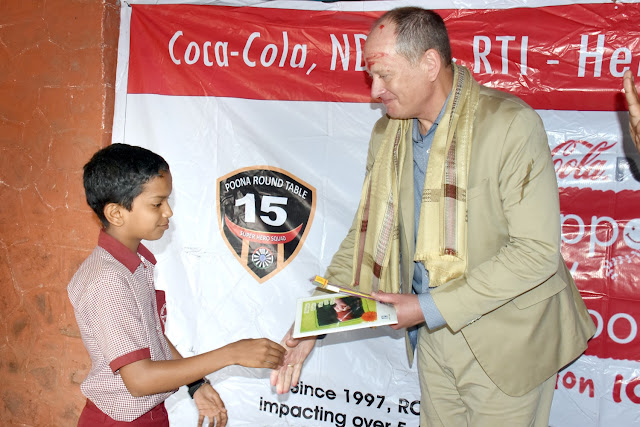 Mr. Greg Koch, Global Director of Water Stewardship, with school Kid