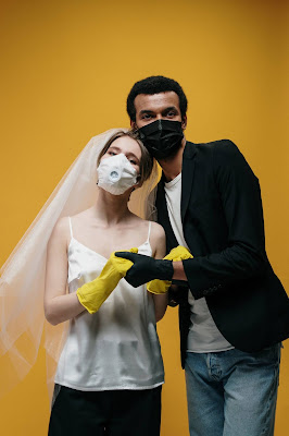 love at first sight leads to this coulple holding hands by wearing a face mask - do care for your loved one