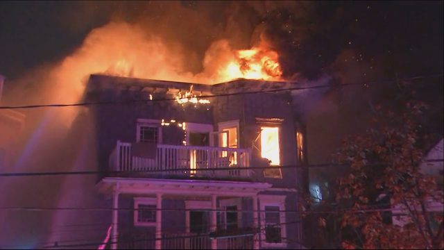 Firefighters Battle A 4-alarm Blaze In Two Buildings In Somerville, Massachusetts