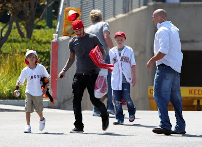 David Beckham and his family playing in the park Pictures