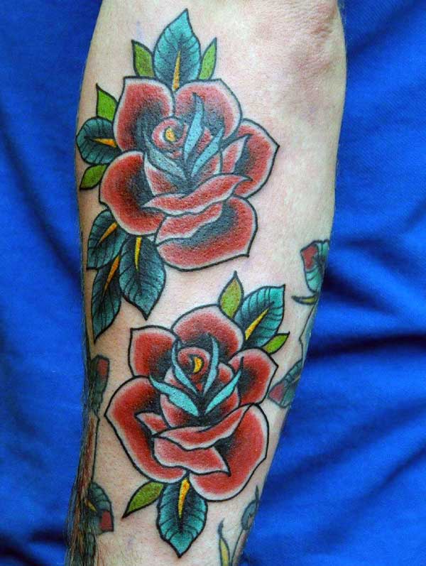 Traditional rose flower tattoo design ink idea on the forearm for male