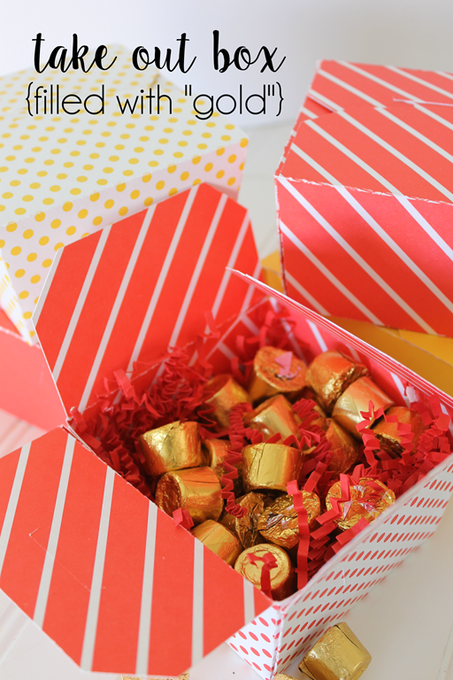 take out box filled with gold Chinese New Year