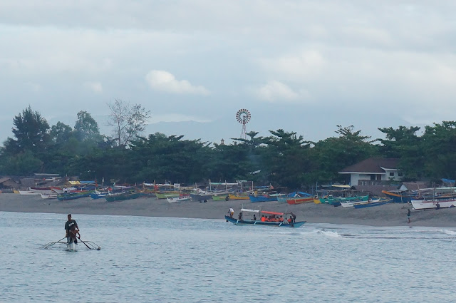 Even from the other side of the cove, tourists can be identified by their mandatory neon orange life vests.