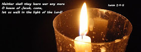 single candle against dark background, with a text from Isaiah 2.4-5: neither shall they learn war any more / O house of Jacob, come, let us walk in the light of the Lord!