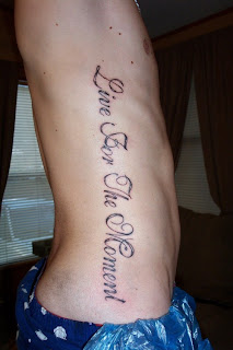 lettering tattoo on ribs