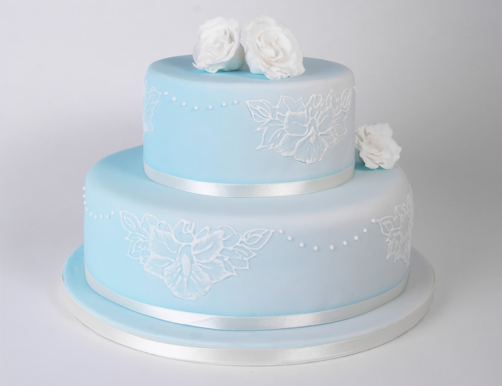 wedding cake decorations ribbon  wedding cake. Simple yet elegant with white ribbon, piped white lace
