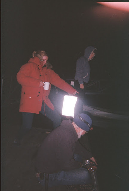 on the dock, fishing for squid