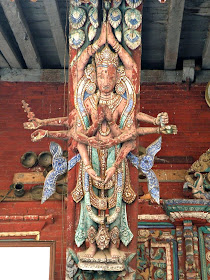Wood carved temple strut depicting a hindu deity in Nepal