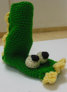 Sweet Nothings Crochet free crochet pattern blog, large detailed photo of the Dinosaur boots showing eyes