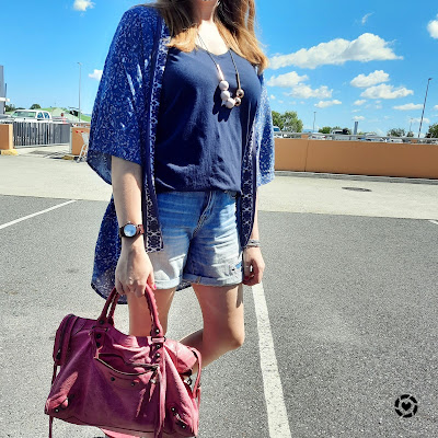 awayfromtheblue Instagram | navy printed kimono v-neck tee, denim shorts and pink Balenciaga city bag