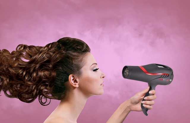 lady blow-drying her hair