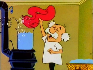 El Doctor Crakenshaft va introduciendo los ingredientes en un vaso de precipitado puesto al fuego
