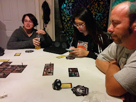 Interviewee John Trobare playing Betrayal at House on the Hill with friends.