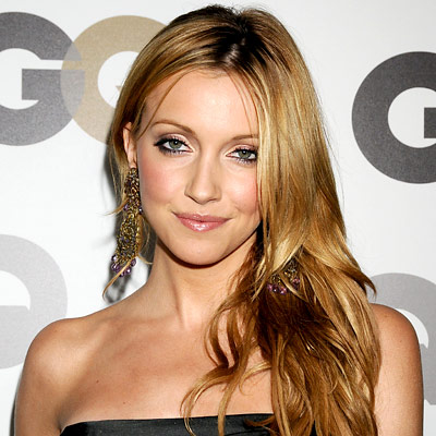 Katie Cassidy's Soft Waves touchable centerparted hair in warm 